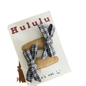Set of two girls' corduroy BB hair clips with classic black and white plaid bows