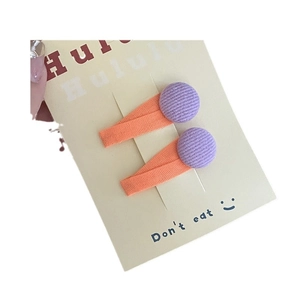 Handmade orange fabric hair clips with purple knit ball charms for girls and kids