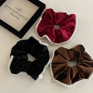 Velvet hair scrunchies with pearls and metal tag in red, brown, and black colors