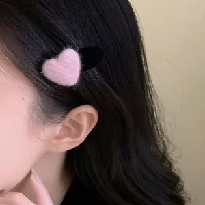 Pink heart-shaped faux mink fur hair clip for side fringe and styling for women