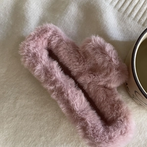 Plush rectangle hair claw clip in dusty pink on soft knit background for women