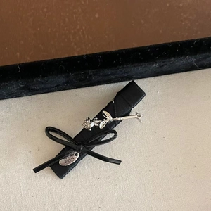 Handmade black satin ribbon bow hair clip with silver rose and handmade tag charm