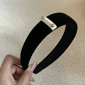 Elegant black velvet headband with gold studs and white rectangle accent hair accessory