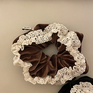 Brown velvet scrunchie with white lace edges and a vintage LUX logo label for women