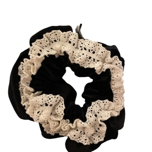 Elegant black velvet hair scrunchie with white lace trim for stylish ponytails