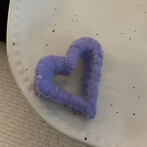 Plush purple heart-shaped claw clip for women featuring a minimalist knitted wool texture