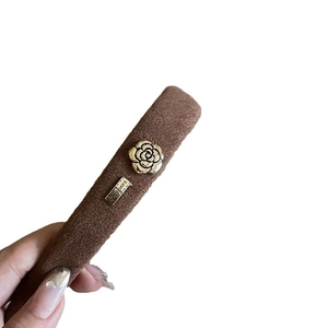 Maillard vintage brown plush headband with golden camellia flower and metal plate detail