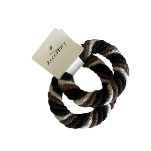 Thick spiral braided hair ties in black brown and beige colors with accessory tag