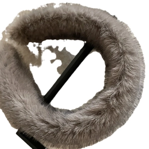 Plush faux fur headband in dark grey designed to add volume and style for women