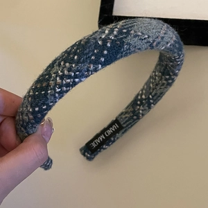 Plaid tweed padded headband in blue tones with a high-top design and handmade label