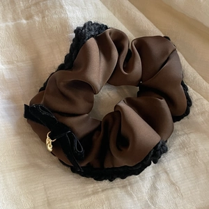Brown satin scrunchie with black crochet trim and velvet bow with gold heart charm