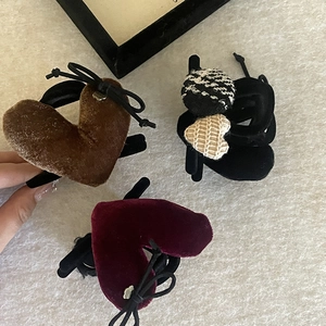 Detail view of vintage velvet heart hair claws with houndstooth texture and bows