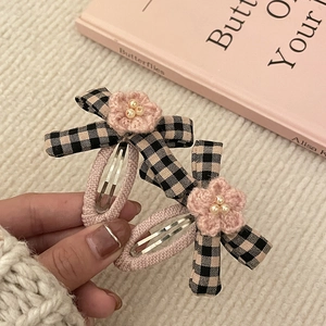 Pink crochet flower hair clips with black and white gingham bows and faux pearls