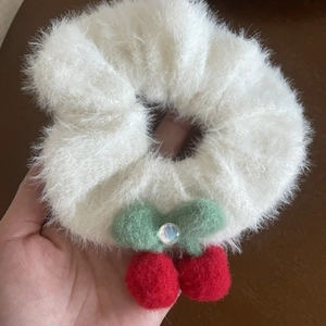 White fluffy faux fur scrunchie with red plush cherry design and iridescent bead detail