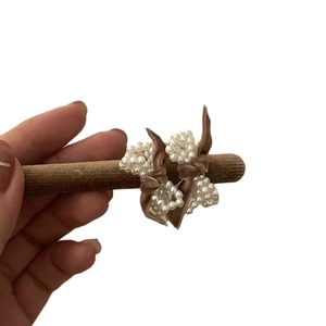 Elegant pearl bow hair clip with brown velvet base for a sweet and stylish feminine look