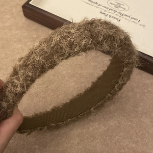 Minimalist plush headband for women with warm brown faux fur texture and non-slip lining