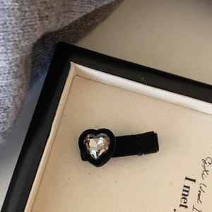 Vintage heart shaped black velvet hair clip with a large grey crystal gemstone