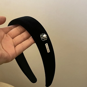 Padded black velvet headband with camellia flower and pearl detail for high skull top