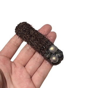 Elegant brown tweed hair clip with grey beads and crystals on a plain white background