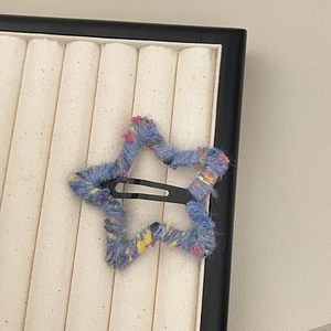 Star-shaped crochet hair clip with blue colorful yarn and metal snap BB clip base
