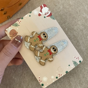 Paire de barrettes à cheveux bonhomme de pain d'épices avec motifs festifs de Noël