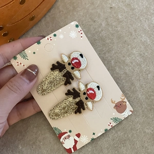 Détails des barrettes de Noël brodées en forme de renne avec paillettes dorées sur carte