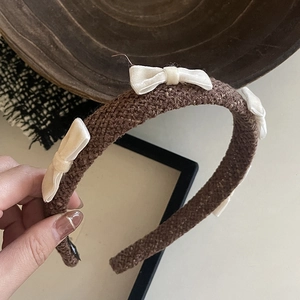 Brown tweed headband with white satin bows featuring a vintage and sweet style for women