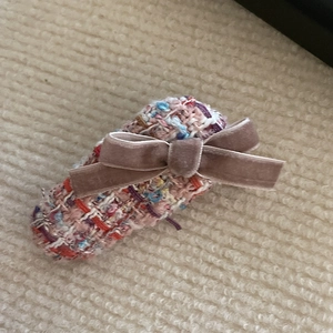 Pink velvet bow hair clip with colorful tweed fabric weave texture for elegant styling
