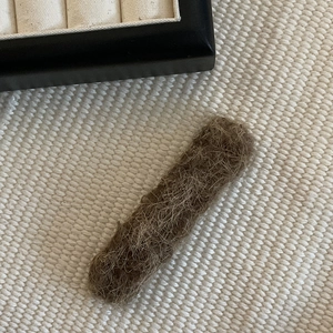 Cute dark brown plush wool felt rectangular hair clip with a soft fiber texture