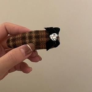 Brown plaid hair clip with black velvet bow and heart rhinestone on a woolen oval base