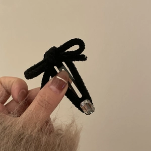 Elegant black velvet bow hair clip with a clear rectangular rhinestone accent for women
