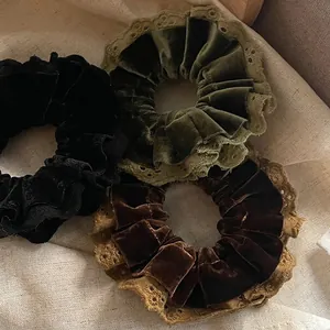 Vintage velvet and lace scrunchies set in black, deep green, and caramel brown colors