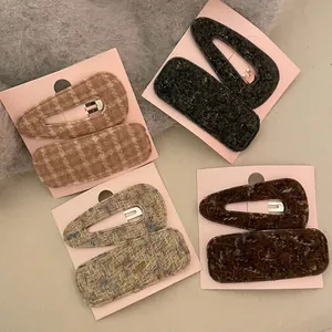 Set of four pairs of woolen plaid and marble pattern BB hair clips for women