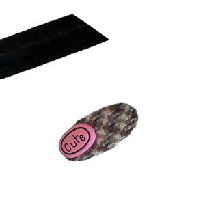 Sweet plaid wool BB hair clip with pink oval 'Cute' charm on white background