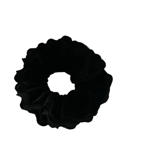 Classic black velvet oversized scrunchie with pleated texture for elegant ponytails