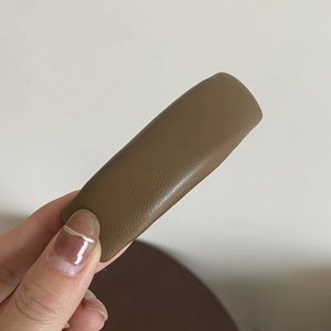 Brown faux leather rectangular hair clip with fine texture for women's hair styling