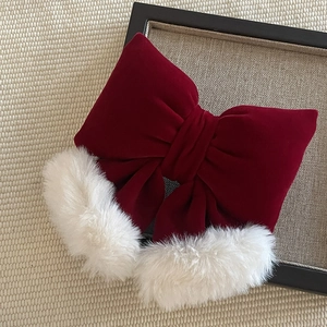 Elegant wine red velvet bow hair clip with white faux fur trim for winter styling