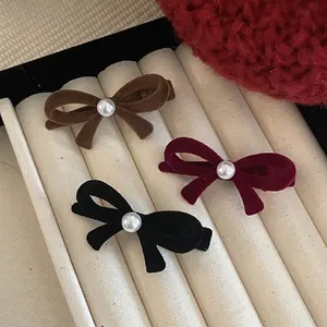 Three-piece velvet bow hair clips with pearls in brown, burgundy, and black elegant styles