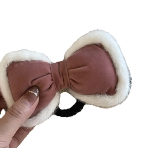 Pink velvet hair scrunchie with plush white fur trim and high elastic band bow accessory