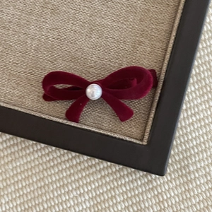 Elegant wine red velvet bow hair clip with white pearl detail for women