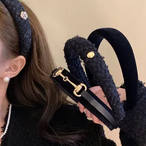 Elegant black velvet headband with horsebit metal buckle and tweed floral hair accessory