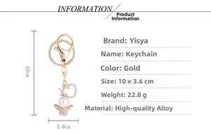 Detailed specs of golden angel keychain with rhinestones and white pearl pendant
