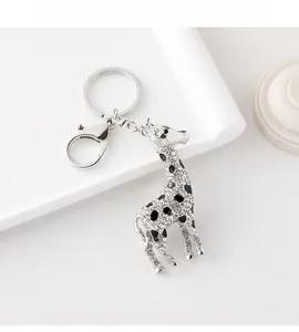 Detailed view of silver giraffe keychain with sparkling crystals and lobster clasp