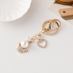 Elegant angel keychain with pearl and heart charm for baptism favor or bag ornament