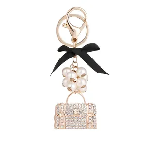 Porte-clés Sac à Main en Strass de Luxe Avec Fausse Künstliche Perle et Nœud en Satin Noir Pendentif de Sac en Métal Doré pour Femme