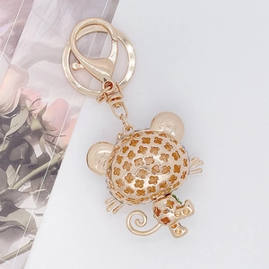 Golden creative hollow cartoon cat keychain with floral patterns and lobster clasp charms