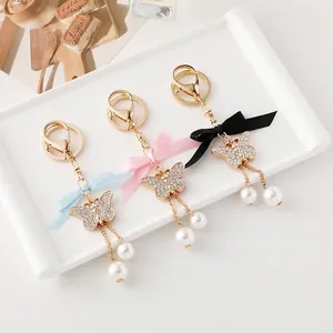 Porte-clés Papillon en Alliage Élégant Avec Strass Nœud en Satin Gland en Künstliche Perle d'Imitation pour Femme Bijoux de Sac