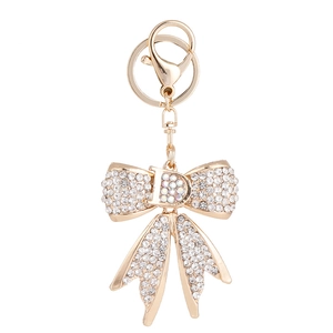 Porte-clés doré avec nœud en strass et breloque lettre D avec fermoir mousqueton