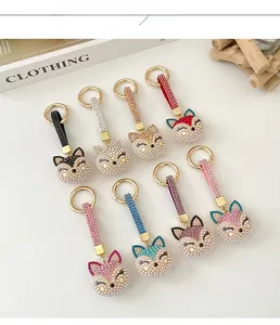 Close-up of rhinestone fox keychains with pearl embellishments in various colors