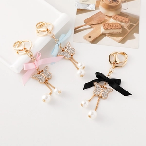 Lot de porte-clés nœud papillon avec perles, glands et cristaux en trois couleurs